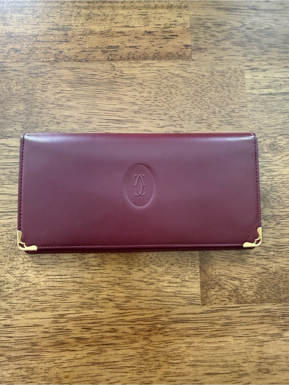 Cartier Burgundy Long Wallet with Gold Corner Accents